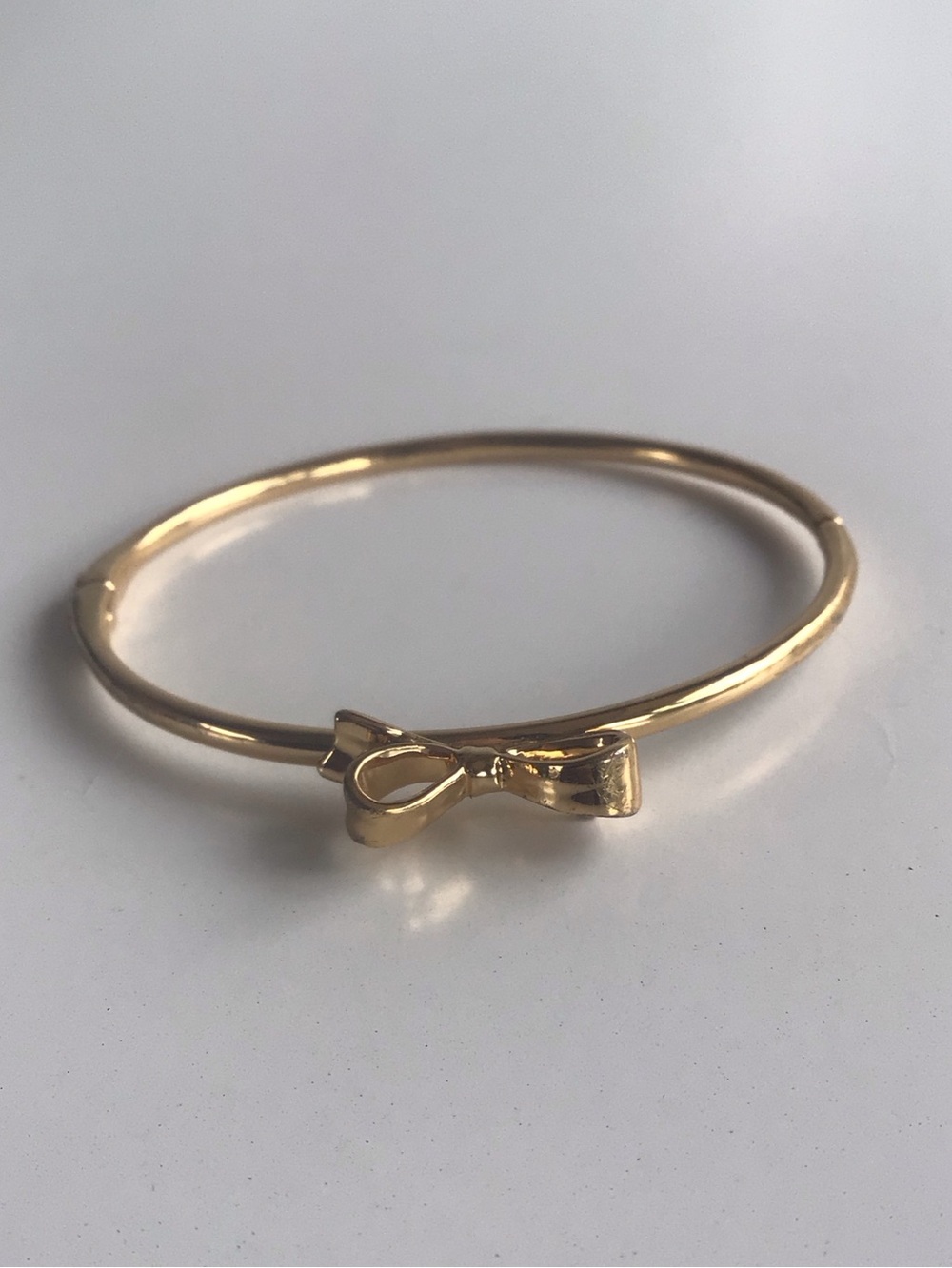 Kate Spade bow gold bracelet bangle